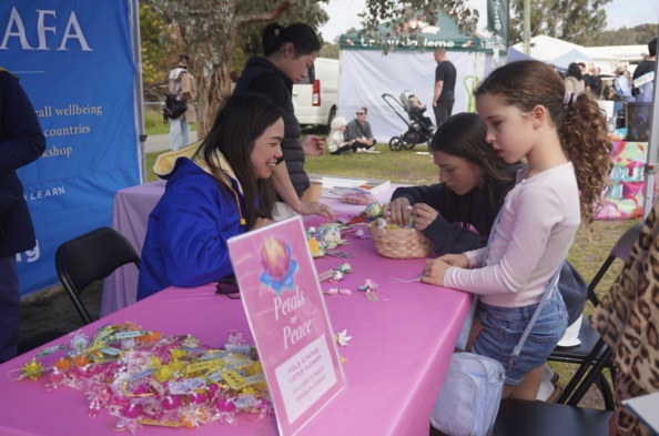 Jennette Quirk and Terry Fitzpatrick at the Falun Dafa booth
