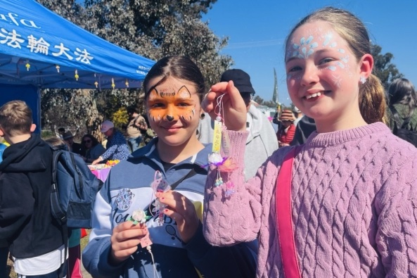 Holly Thompson and Isabella Taylor with lotus pendants