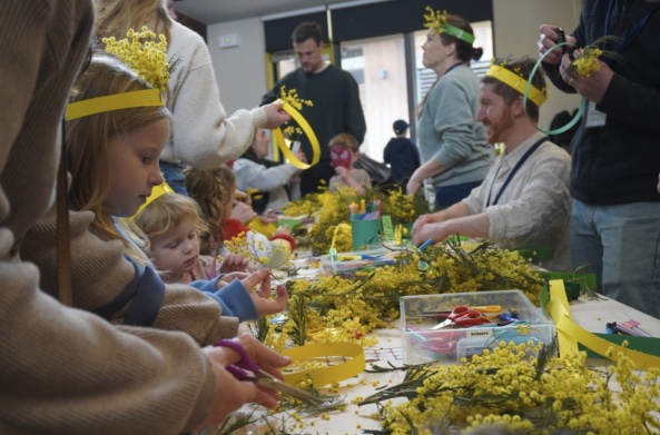 People making flower garlands at the festival