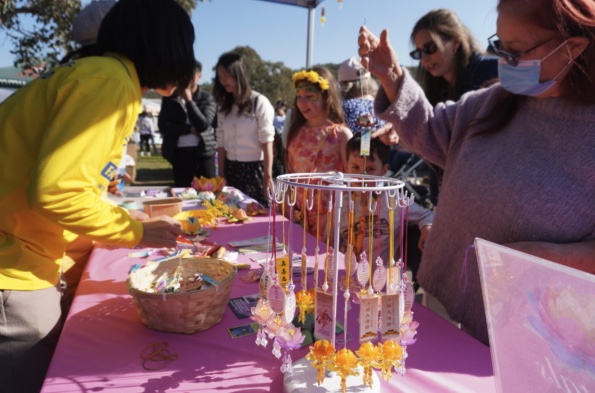 Children interacting with a performer at the festival